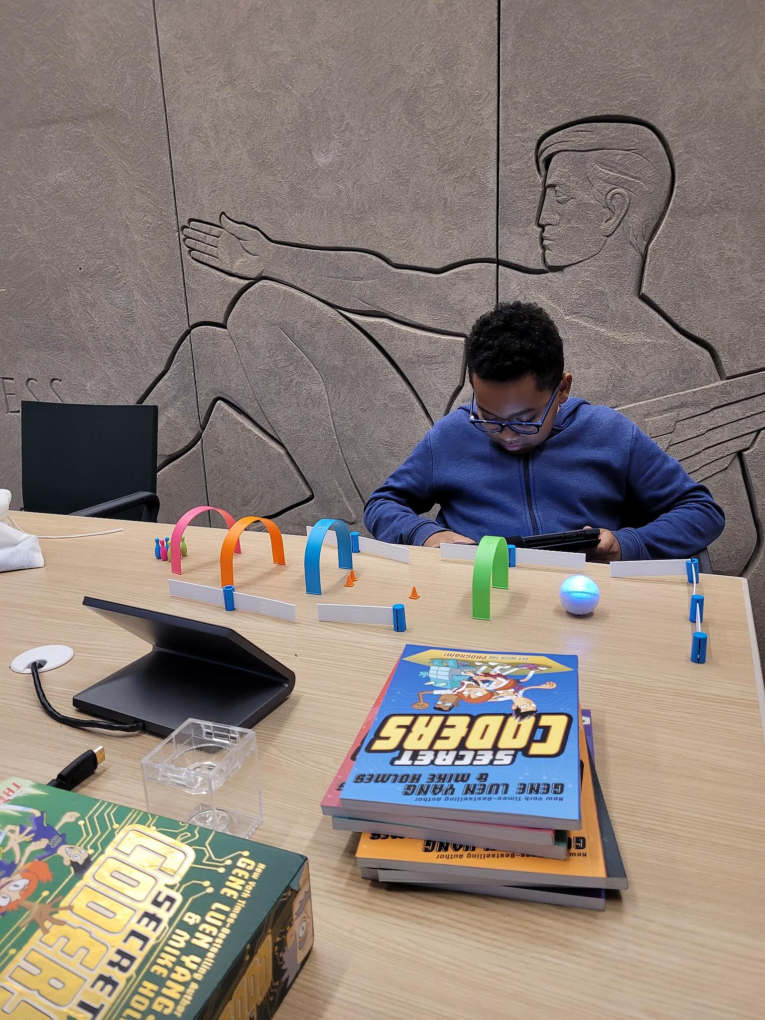 Programming the robot at the library table